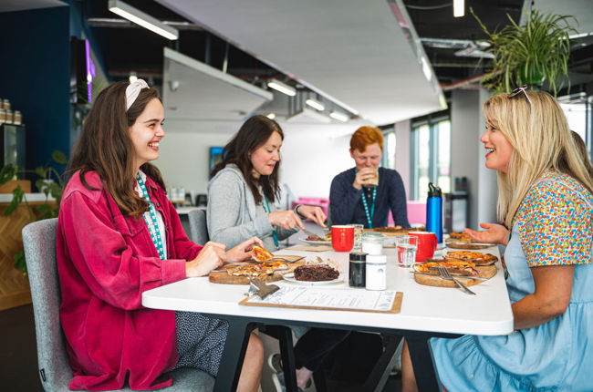 Group of people having lunch and discussing