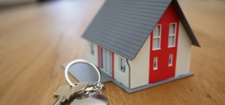 House model and house keys on a table 