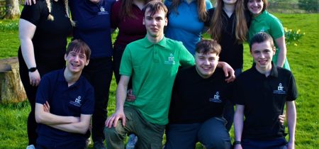 Participants of The Duke of Edinburgh Award standing in a field 